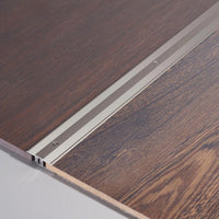 DURAL Übergangsprofil DUOFLOOR titan mit sichtbaren Schrauben zwischen Parkett verarbeitet